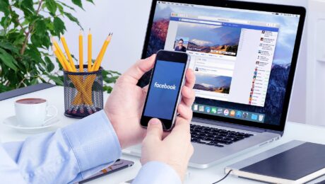 A smartphone user shows the Facebook application on his phone in the Raleigh, North Carolina, in this photo illustration,